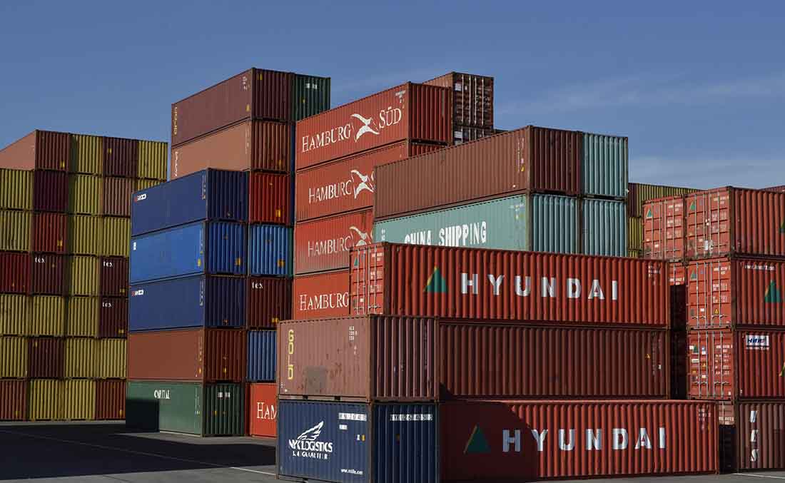 A Photo Of Containers Stacked At A Port